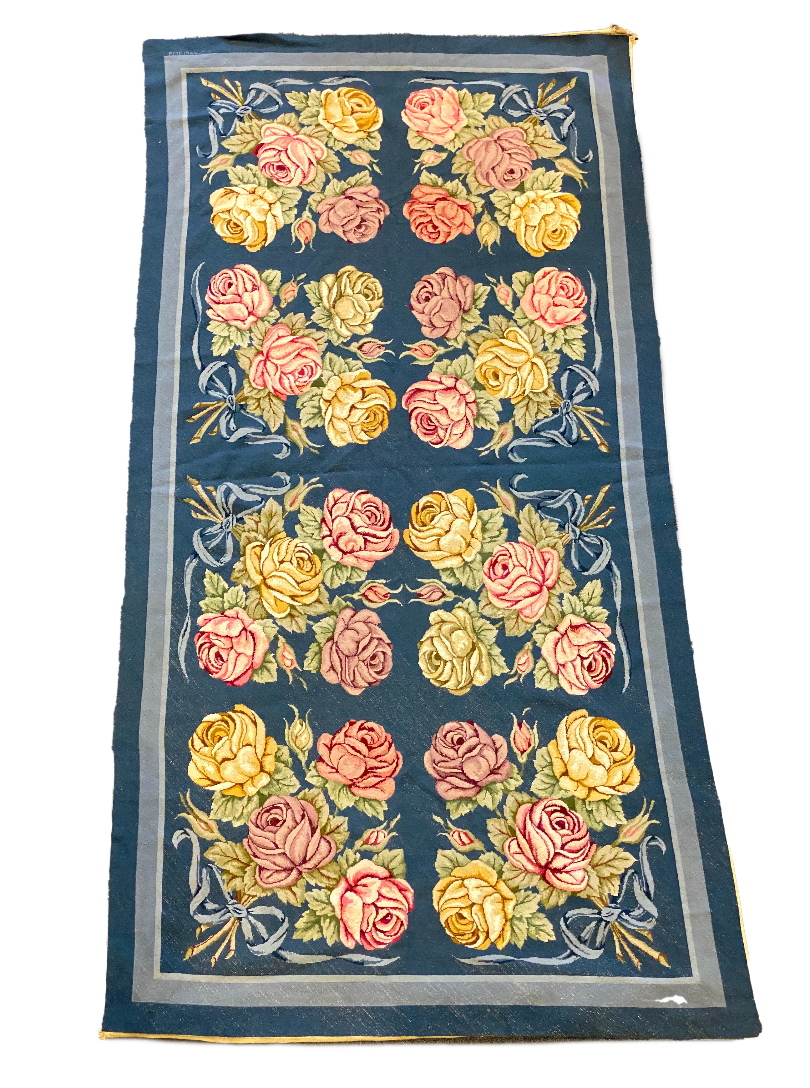 An English needlepoint blue ground carpet, 252 x 125cm